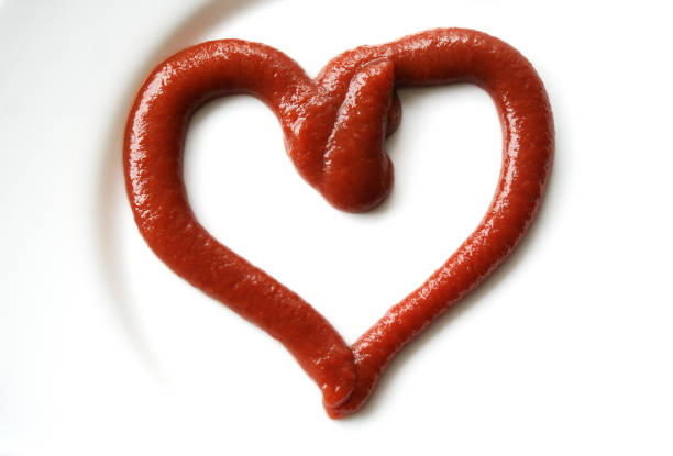 istock Ketchup in the form of a heart on dinner plate. 1178339907