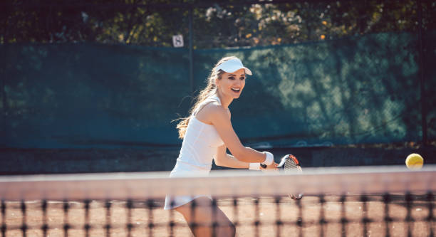 istock Woman forcefully playing tennis 1178341928