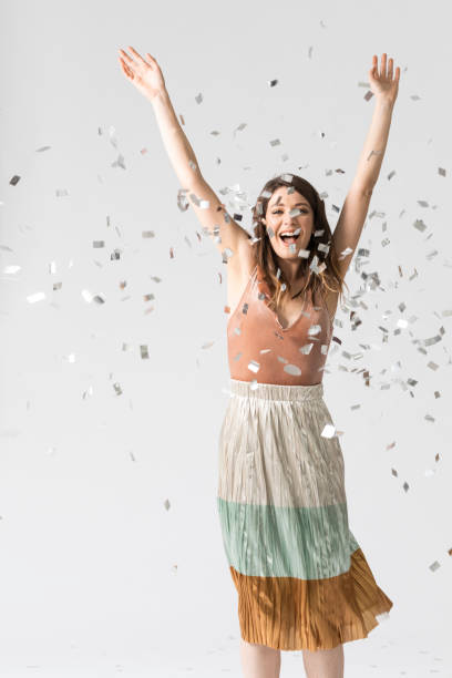 istock Happy Woman Dancing Under Confetti 1178342910