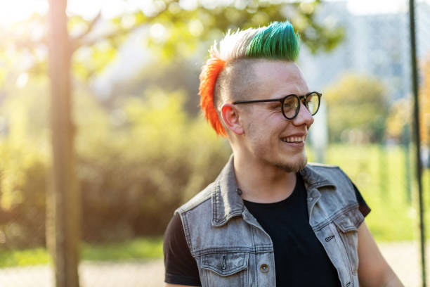 istock Portrait of a cool young man with pink mohawk 1178342983