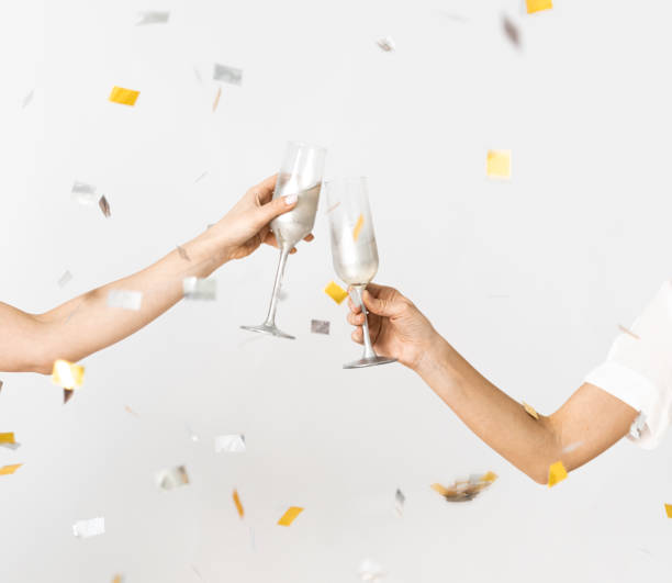 シャンパンと紙吹雪のお祝い - シャンペンフルート ストックフォトと画像