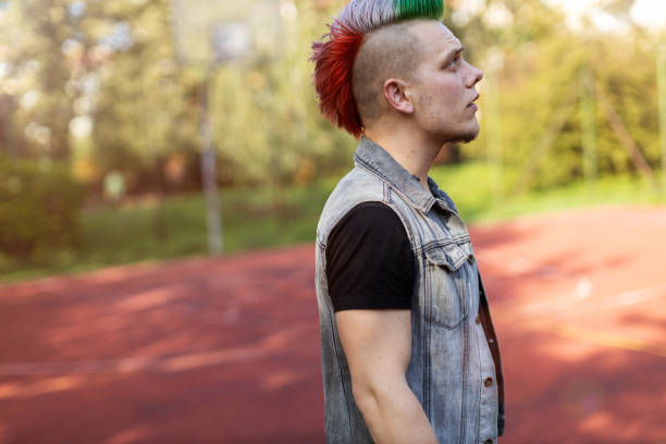 istock Portrait of a cool young man with pink mohawk 1178343106