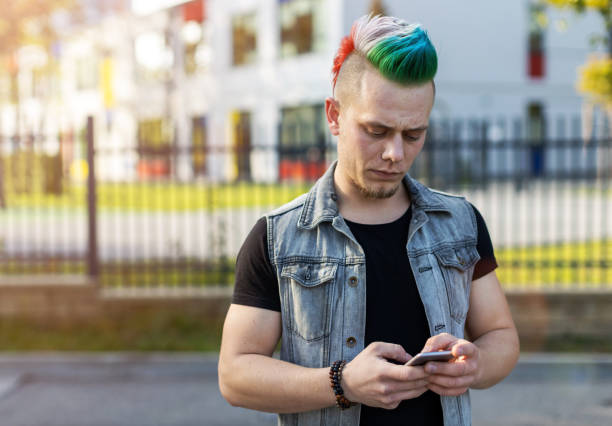 istock Young punk man with smart phone 1178343112