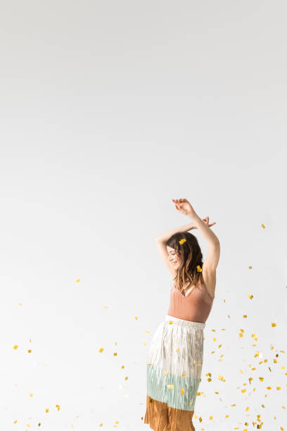 istock Happy Woman Dancing Under Confetti 1178343289