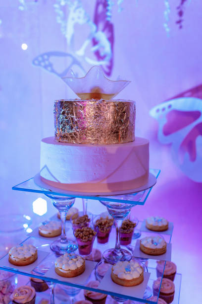 istock Wedding cake and candy bar. wedding cake and cupcakes 1178343576