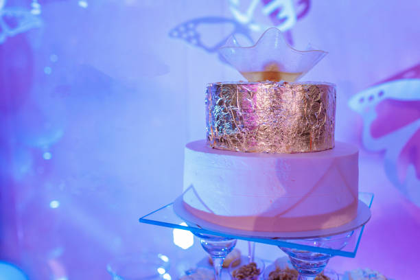 istock Wedding cake and candy bar. wedding cake and cupcakes 1178343583
