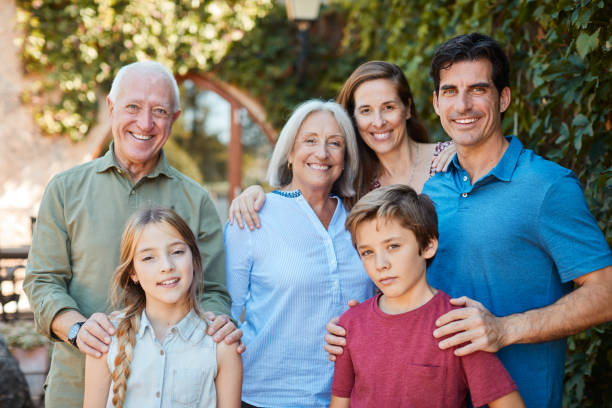 Multi-generation family portrait looking at the camera.