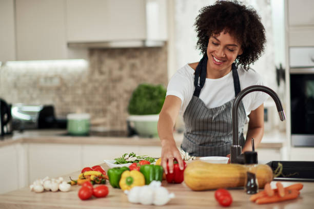 istock Woman preparing meal at home. 1178345230
