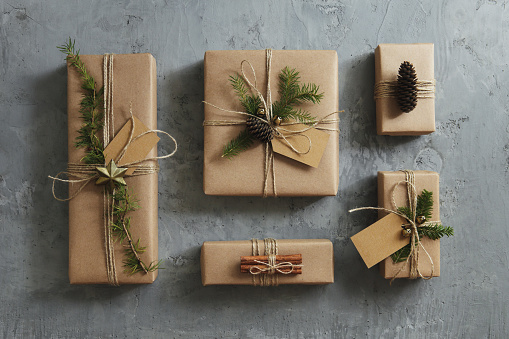 High angle view of Christmas presents wrapped in kraft paper