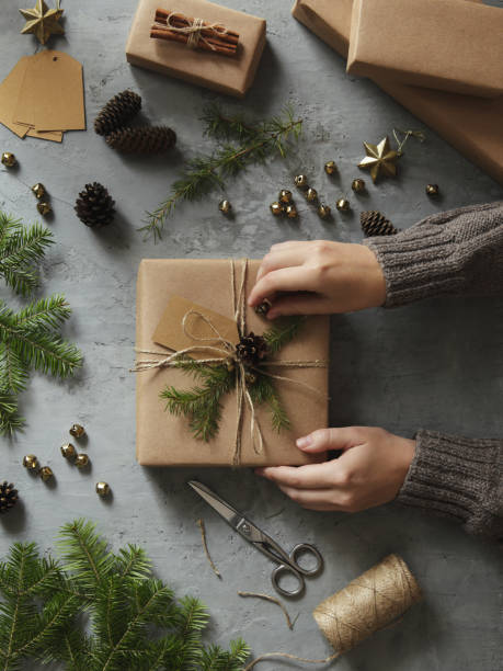Woman decorating Christmas presents