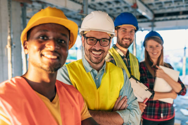 istock Group of workers with hardhats standing together 1178346836