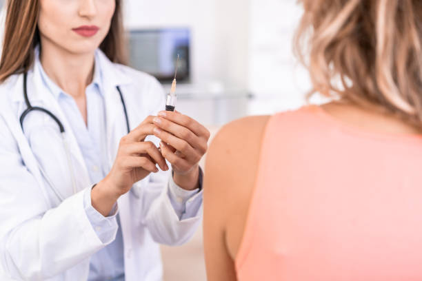 istock Female doctor vaccinating a patient 1178350272