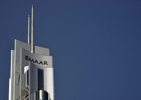 Dubai, United Arab Emirates: The Address Boulevard skyscraper - top section with Emaar properties logo, crowned by two matching spires - Sheikh Mohammed Bin Rashed Boulevard, Downtown Dubai - designed by Atkins amd NORR Group Consultants International