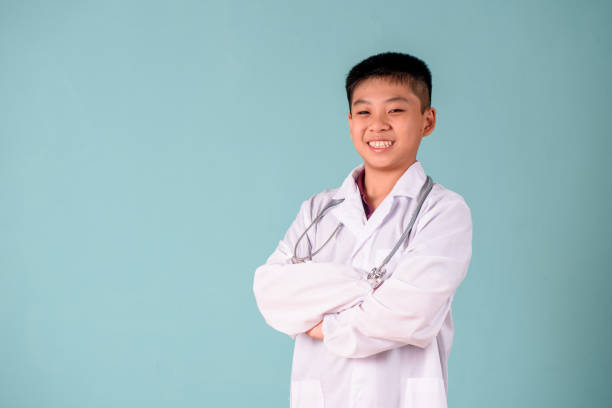 istock Young asian boy in doctor costume 1178353606
