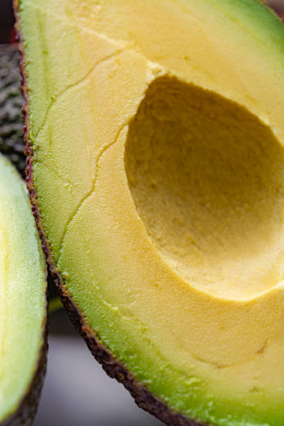 istock Macro photo, fresh ripe hass avocado, cut in half 1178358071