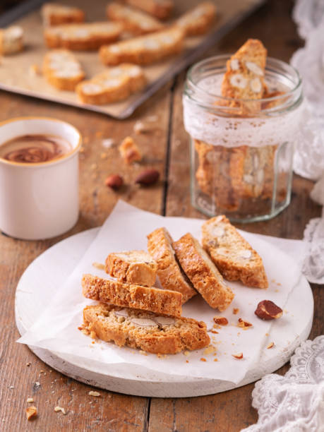 istock Traditional Catalan biscotti carquinyolis, cookies or cantuccini, with almonds nuts and coffee. Wooden table with copy space. Close up. Still Life concept, bakery product. 1178359600