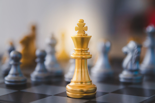 King is leader strategy ideas concept business. Golden chess board game business, leader with success.