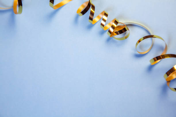 Blue background with golden curled ribbon strip
