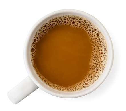 Cup of coffee on a white background. The view of the top.