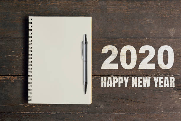 istock Numbers 2020 for Happy New Year and notebook with pen for copy space. 1178366577
