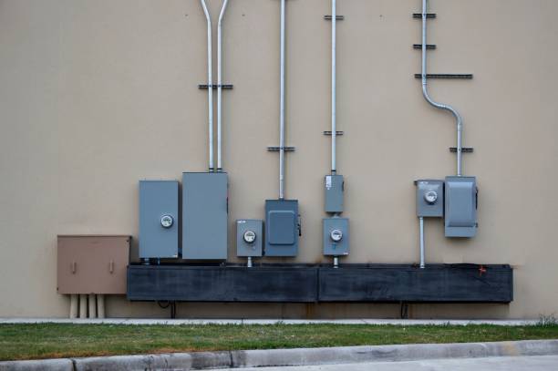 power utility boxes on a generic wall of a business. - floorbox imagens e fotografias de stock