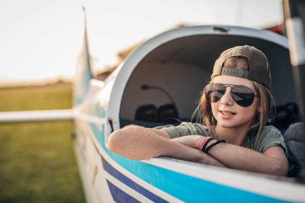 Girl sitting in the propeller airplane