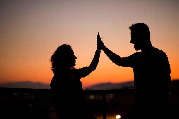 istock valentines celebrating their success at sunset 1178371480