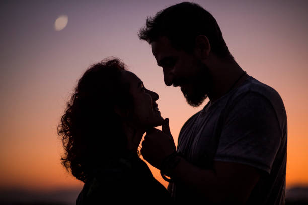 istock romantic couple at sunset 1178371548