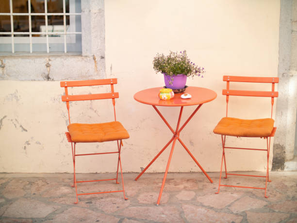 istock Orange chairs and table on the street 1178371810