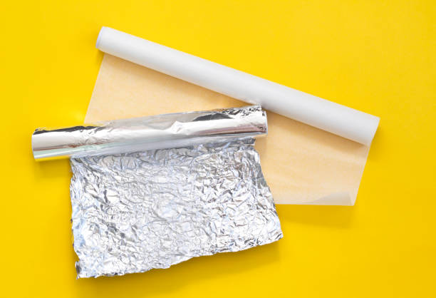 https://media.istockphoto.com/id/1178373671/photo/unwound-white-parchment-baking-paper-and-crumpled-foil-on-a-yellow-background-top-view.jpg?s=612x612&w=0&k=20&c=GTrLbO4a445IRrg4q1kRqY4sm9Yp0t61PQLagK939CI=