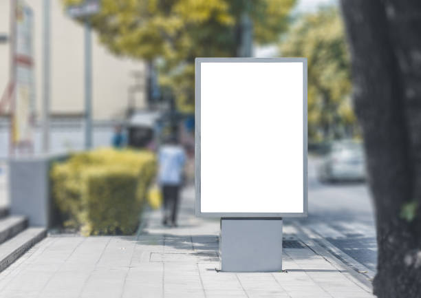 istock led blank billboard white screen side road in city. ad mockup copy space for advertising banner near bus stop in metropolis. 1178373849