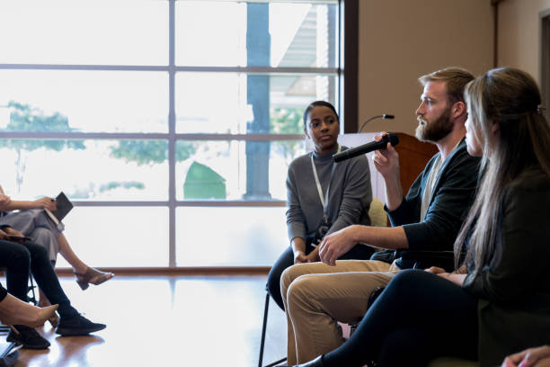 istock Panel members speak to audience of teachers about classroom order 1178374706