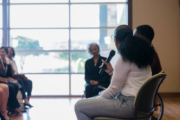 istock Unrecognizable female panel member addresses expo audience 1178374715