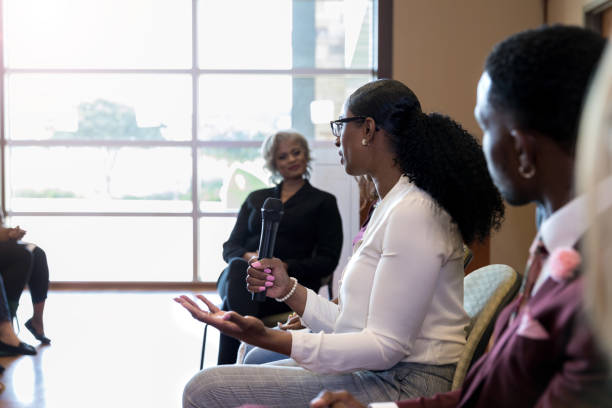 istock Mid adult woman gestures as she explains her position 1178374721