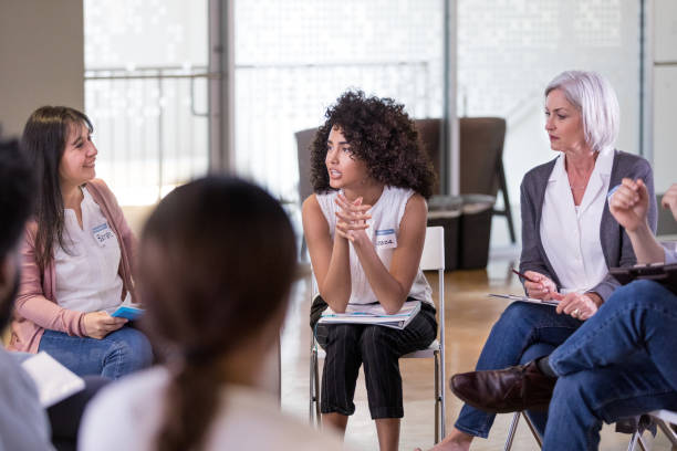 istock Woman discussing community events with neighbors 1178375574