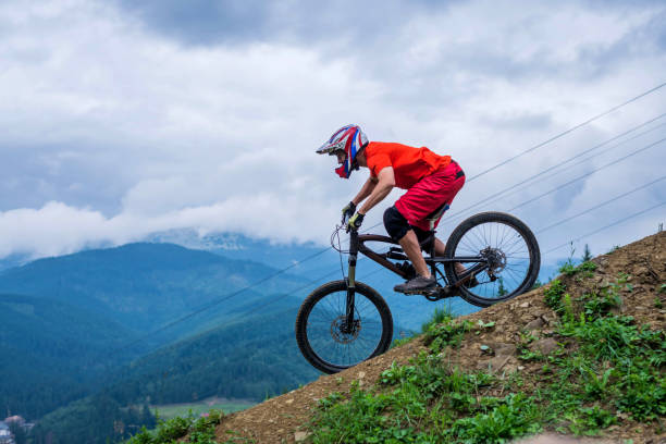istock Cyclist riding a mountain bike from a mountain. 1178375584