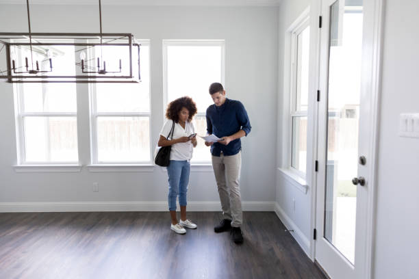 istock Husband and wife review specifications on new home 1178376487