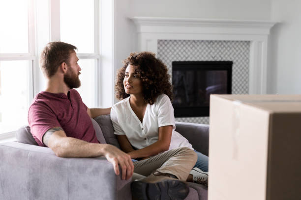 istock Sitting in new house, husband and wife chat 1178376501