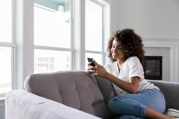 istock Confident woman relaxing on sofa 1178376620