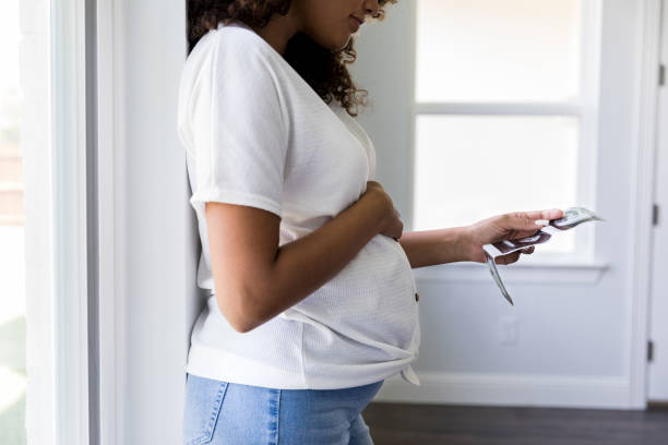 istock Pregnant woman looking at sonogram image 1178376638