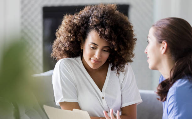 istock Young woman talks with interior designer 1178376663