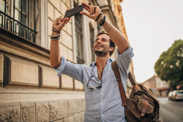istock Man photographing in the city 1178376882