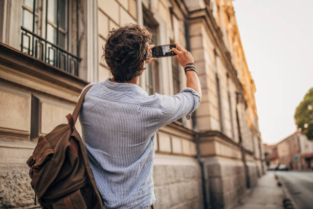 istock Man photographing in the city 1178376912
