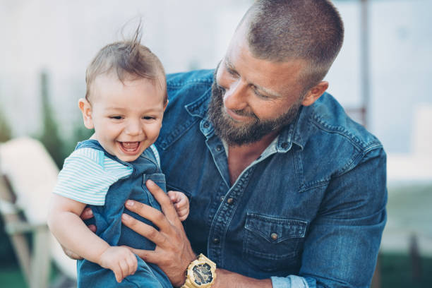 Father and baby boy happy together