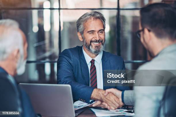 Businessmen Handshake In The Office Stock Photo - Download Image Now - Business, Handshake, Businessman
