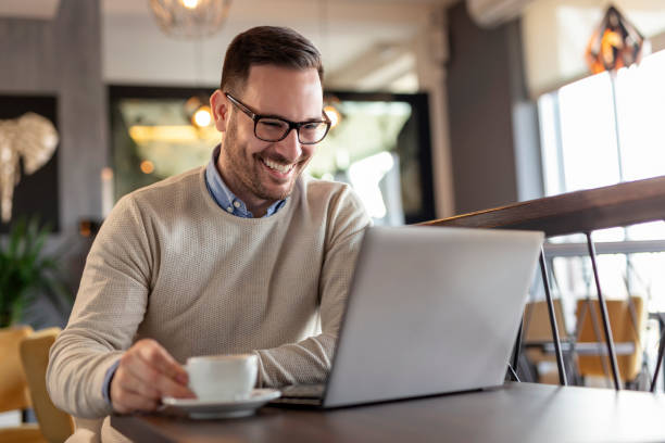 istock Businessman working on a laptop computer and drinking coffee 1178386778