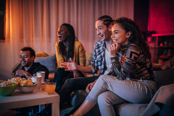istock Multi-ethnic friends watching TV together 1178389345