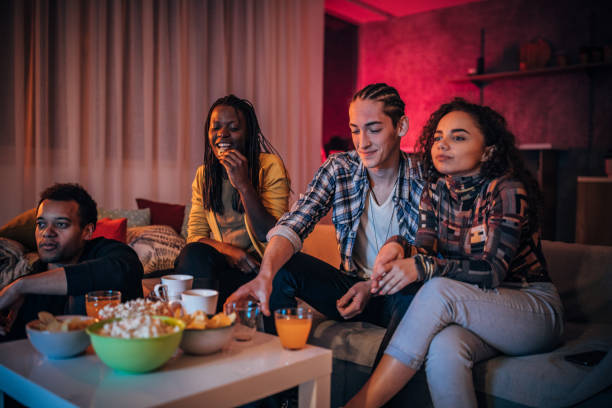 istock Multi-ethnic friends watching TV together 1178389414
