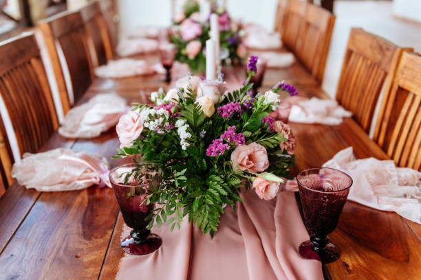 istock Vintage festive table setting with pink roses, candles and cutlery 1178389521