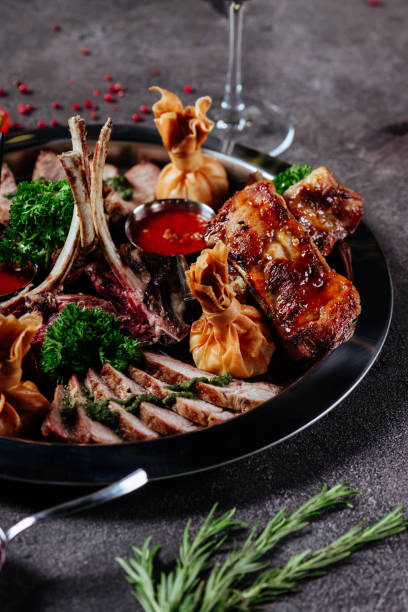 istock Mixed grilled meat platter. Assorted delicious grilled meat with vegetable. 1178389860